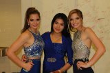 Chloe Chedester, foreign exchange student Sam Muhammed, and Sammi Chedester enjoy the annual Winter Dance Saturday night.